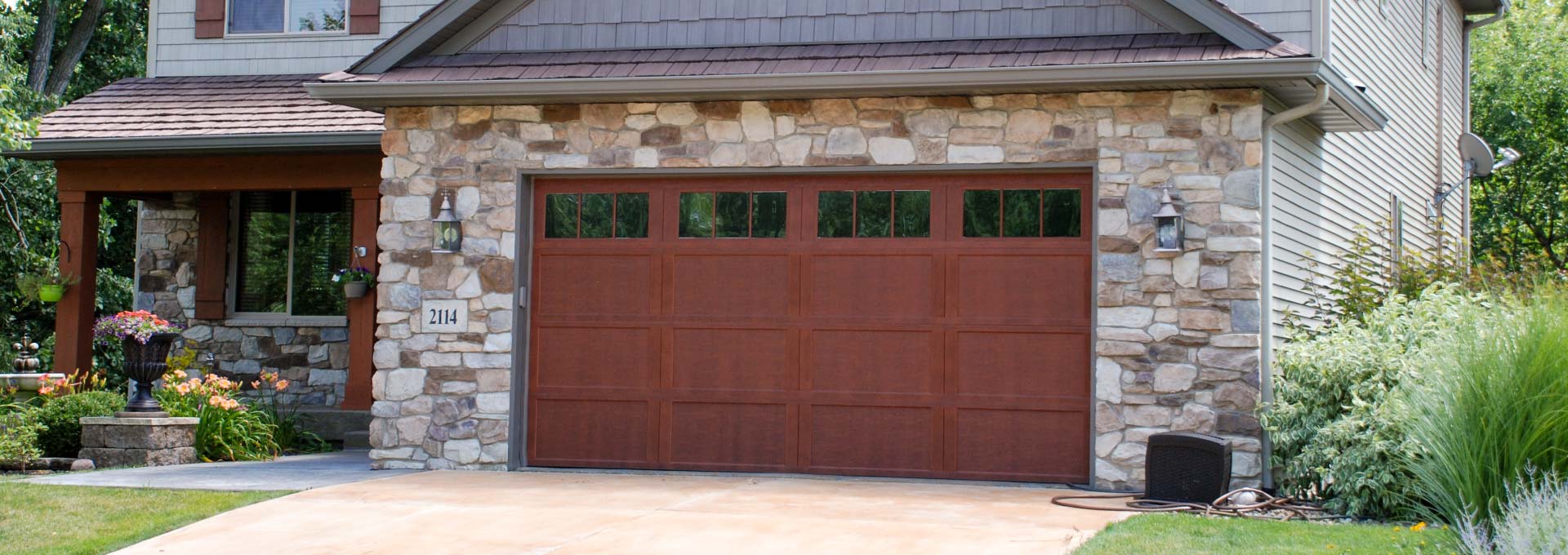 Distinctive maintenance free Carriage House designs available in stained and painted finishes.