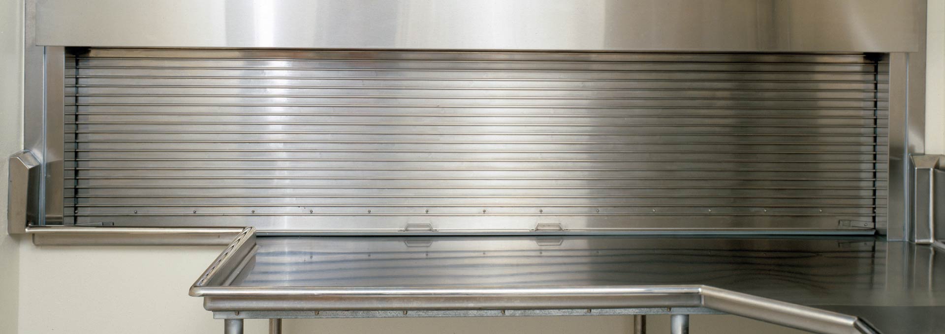 Comprehensive system of counter doors encompasses three basic types -- metal curtain, wood curtain and integral frame and sill