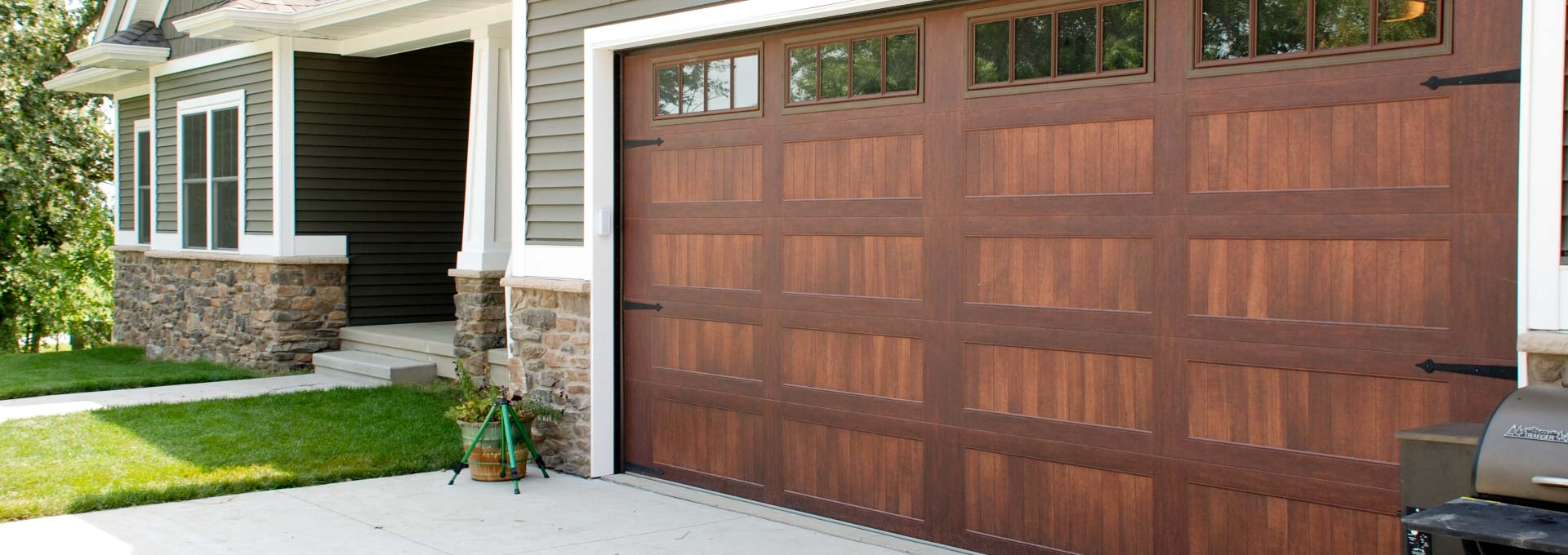 The unique look of stained wood on a maintenance free metal door.