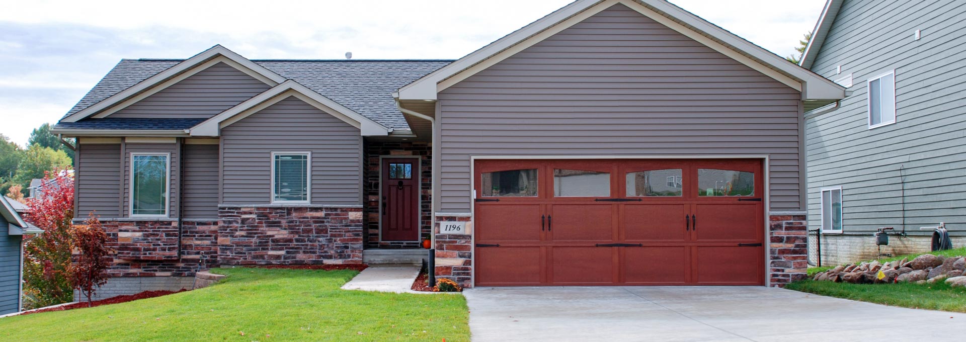 Distinctive maintenance free Carriage House designs available in stained and painted finishes.