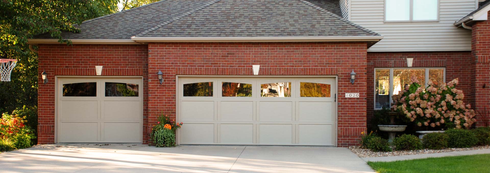 Distinctive maintenance free Carriage House designs available in stained and painted finishes.