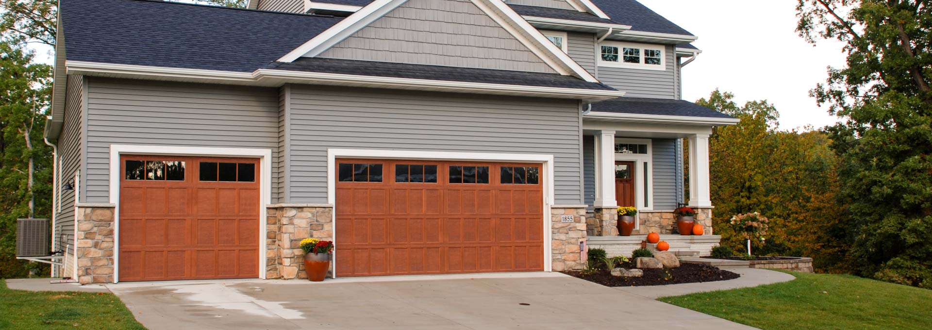 Distinctive maintenance free Carriage House designs available in stained and painted finishes.