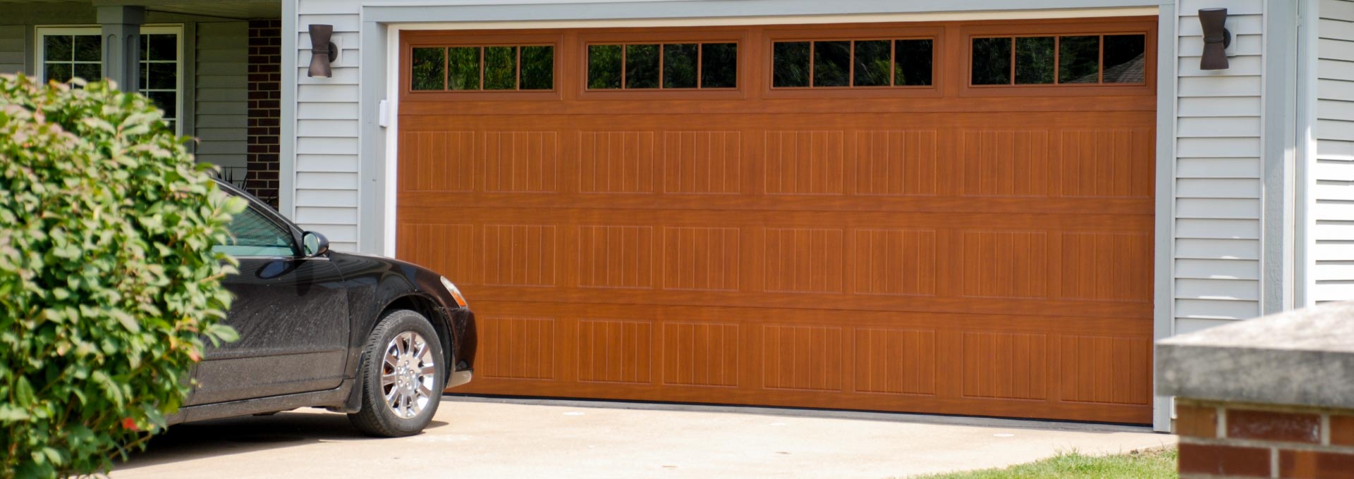 The unique look of stained wood on a maintenance free metal door.