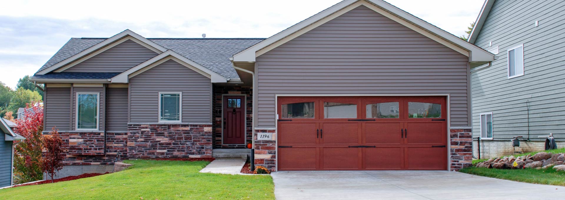 The unique look of stained wood on a maintenance free metal door.