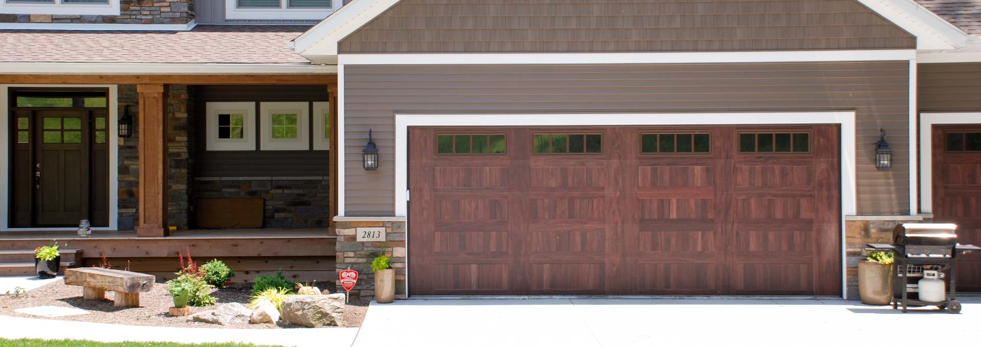 The unique look of stained wood on a maintenance free metal door.