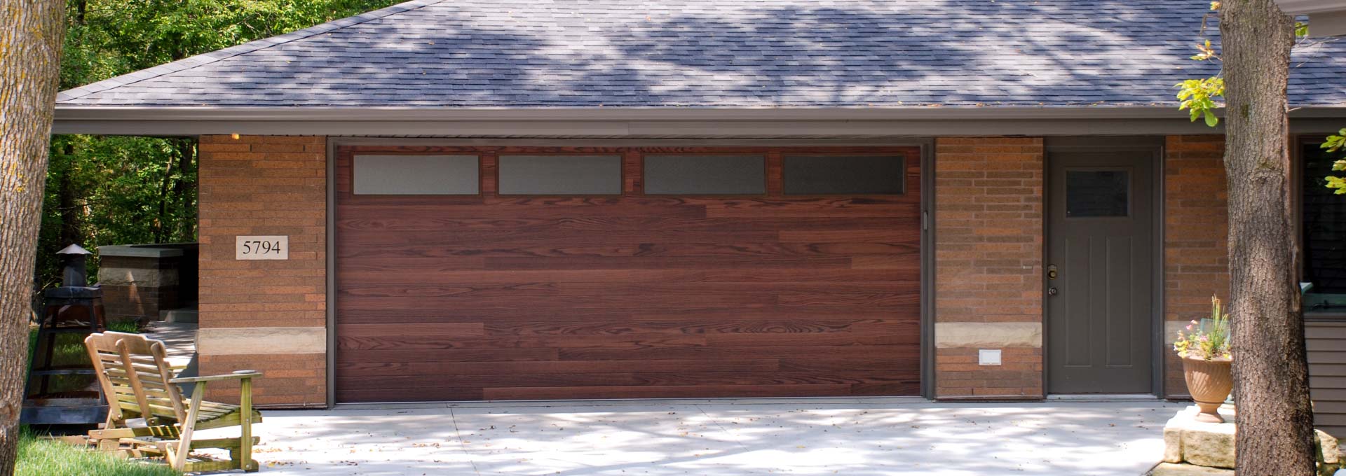 The unique look of stained wood on a maintenance free metal door.