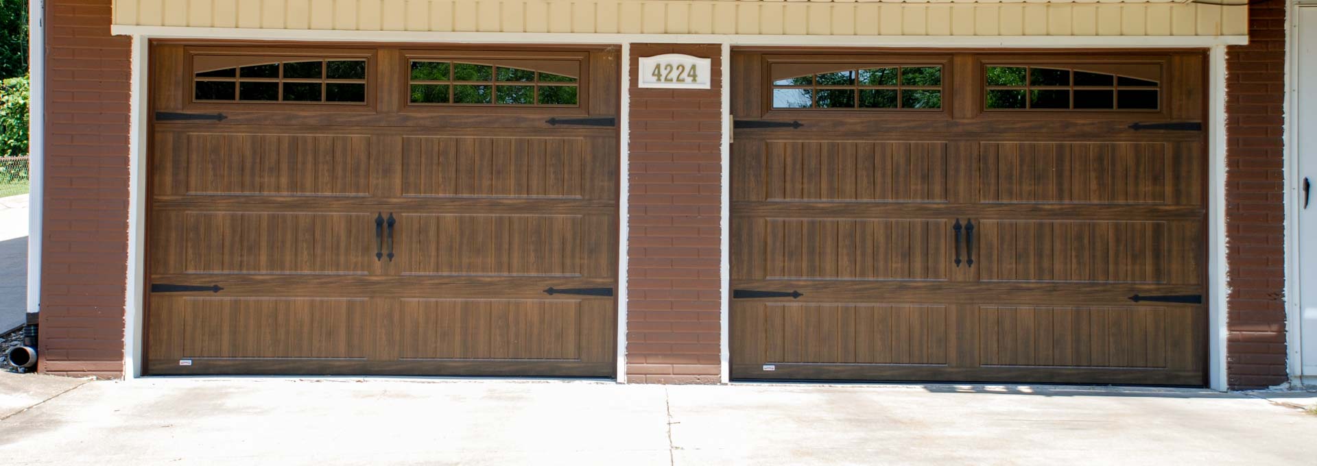 The unique look of stained wood on a maintenance free metal door.