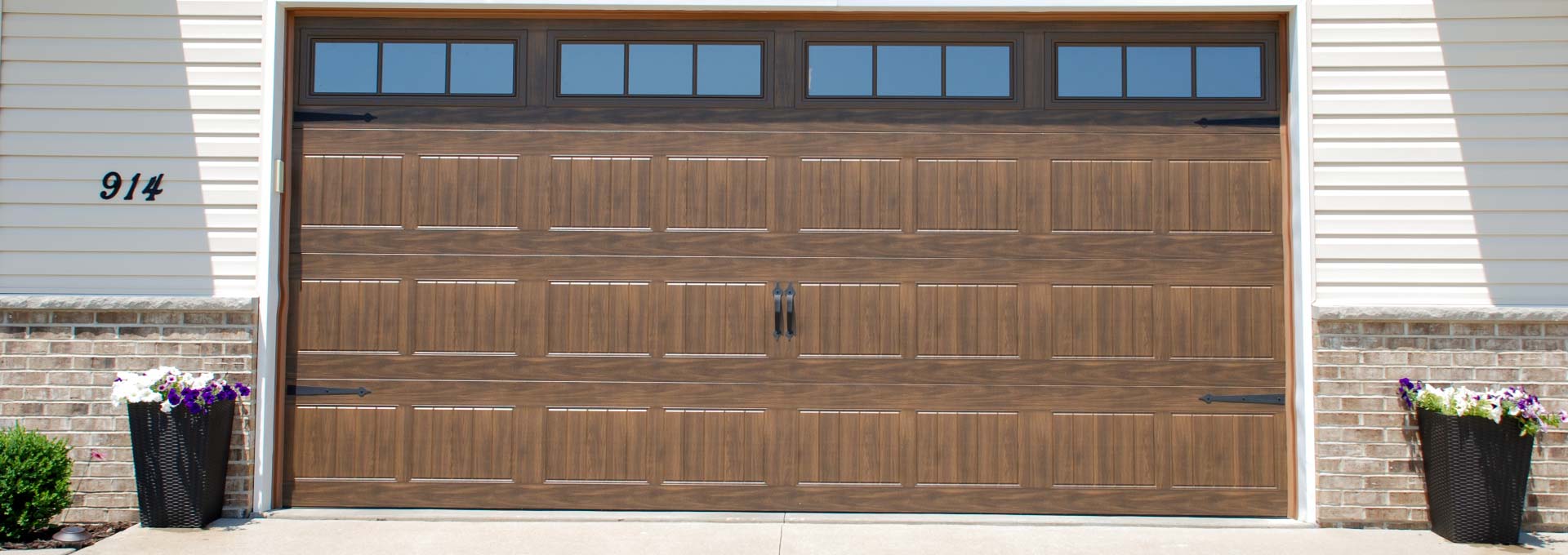 The unique look of stained wood on a maintenance free metal door.